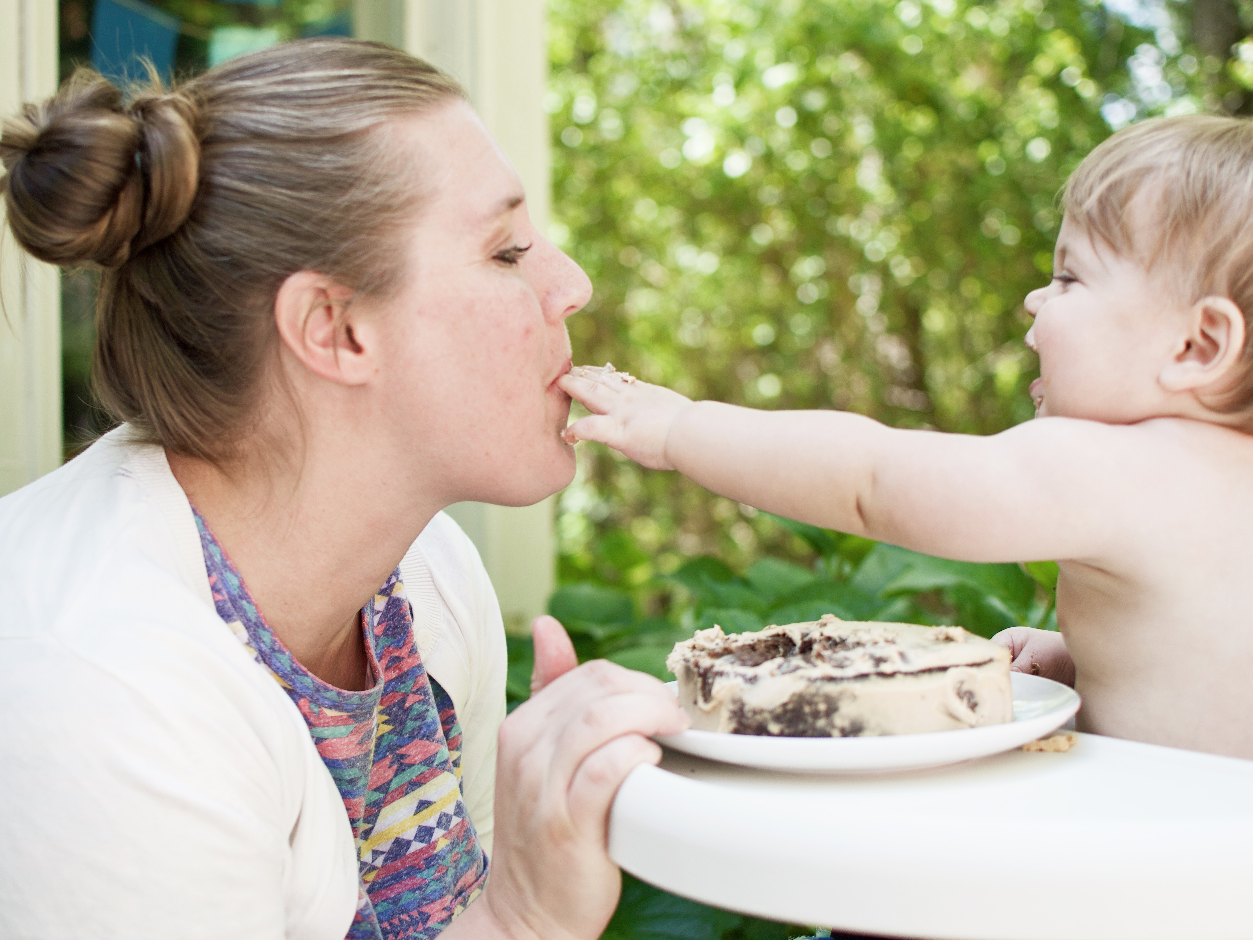 first birthday cake feeding mama