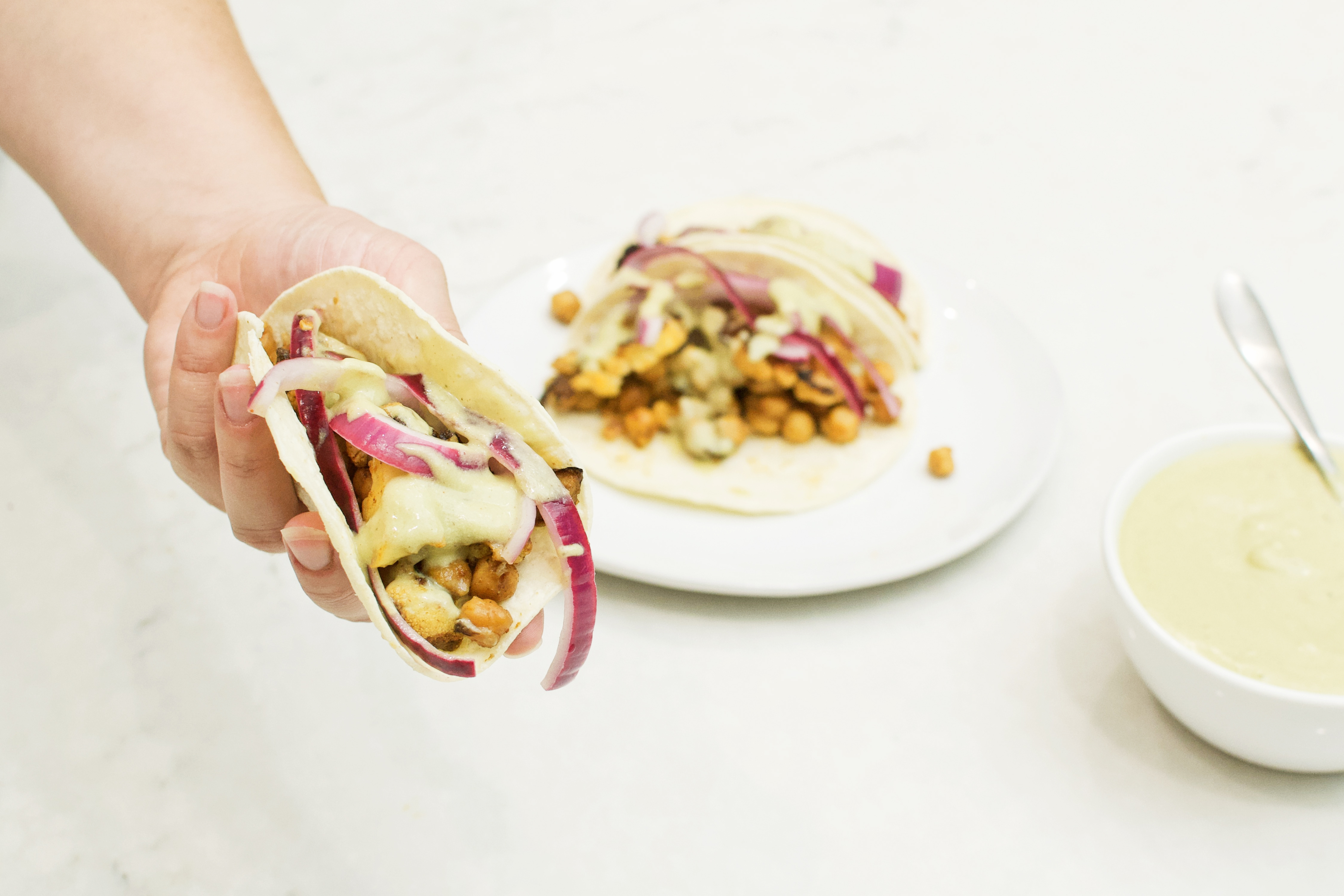 Chickpea and Cauliflower Tacos with Avocado-Lime Crema