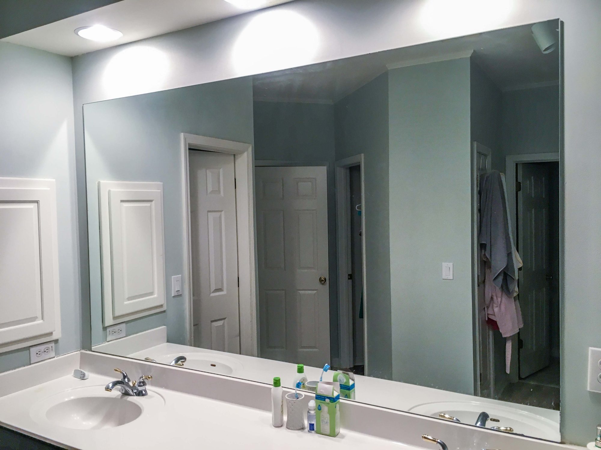 How to DIY Upgrade Your Bathroom Mirror With a Stained Wood Frame